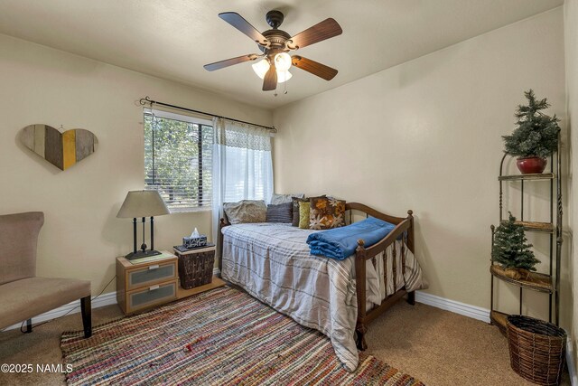 3200 S Litzler Dr Unit 3-212, Flagstaff, AZ 86005 - bedroom with carpet floors, baseboards, and ceiling fan