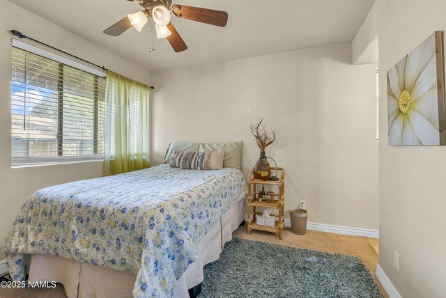 3200 S Litzler Dr Unit 3-212, Flagstaff, AZ 86005 - carpeted bedroom with baseboards and ceiling fan