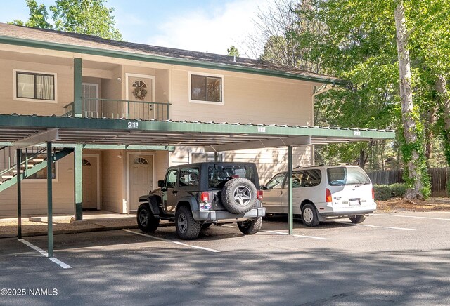 3200 S Litzler Dr Unit 3-212, Flagstaff, AZ 86005 - view of building exterior with covered parking and stairway