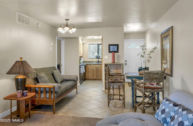 3200 S Litzler Dr Unit 3-212, Flagstaff, AZ 86005 - living room with light tile patterned floors and a chandelier