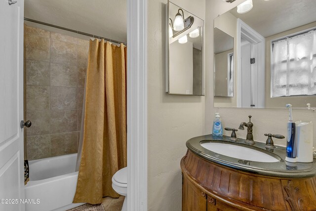3200 S Litzler Dr Unit 3-212, Flagstaff, AZ 86005 - bathroom featuring vanity, shower / bath combination with curtain, toilet, and tile patterned floors