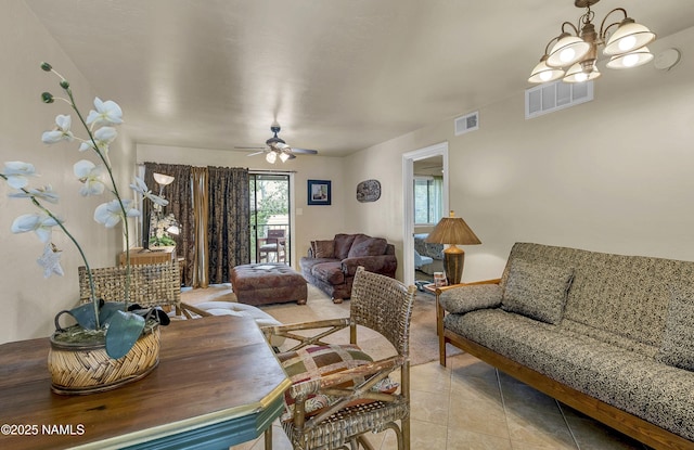 3200 S Litzler Dr Unit 3-212, Flagstaff, AZ 86005 - living area with light tile patterned floors, a chandelier, and ceiling fan