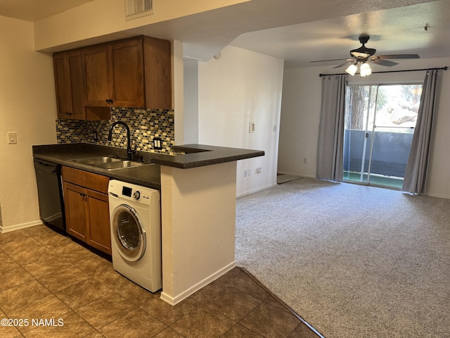 1385 W University Ave Unit 196, Flagstaff, AZ 86001 - kitchen with washer / dryer, a sink, dark countertops, and black dishwasher