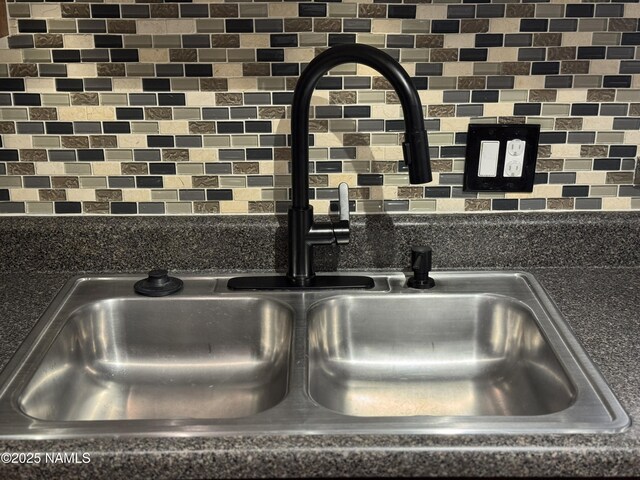 1385 W University Ave Unit 196, Flagstaff, AZ 86001 - kitchen view of a sink, backsplash, and dark countertops