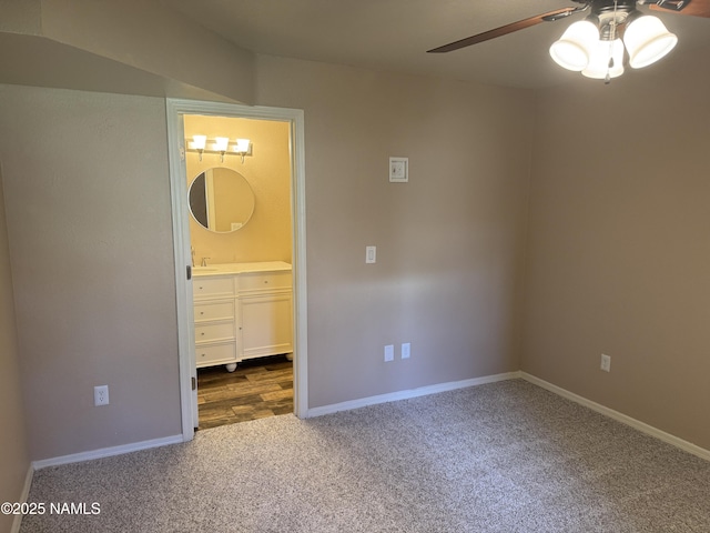 1385 W University Ave Unit 196, Flagstaff, AZ 86001 - unfurnished bedroom with carpet floors, baseboards, ensuite bathroom, and a ceiling fan