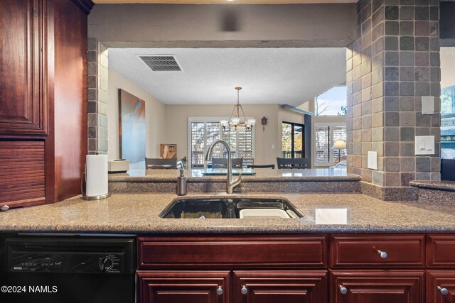 2900 N Saddleback Way Unit 9, Flagstaff, AZ 86004 - kitchen with sink, light stone counters, a chandelier, a textured ceiling, and dishwasher
