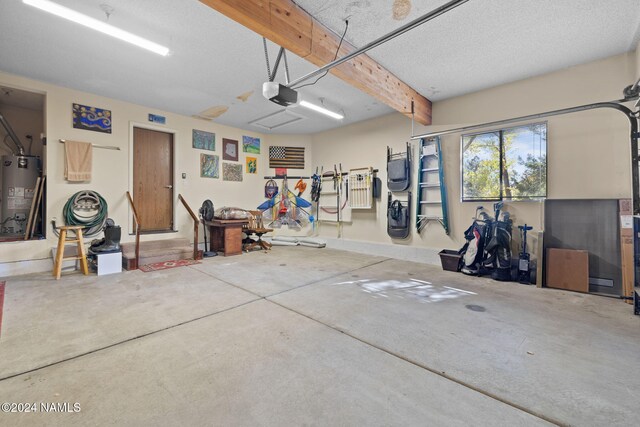 2900 N Saddleback Way Unit 9, Flagstaff, AZ 86004 - garage featuring a garage door opener and gas water heater