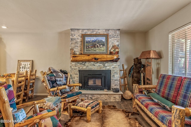 sitting room with hardwood / wood-style floors and a fireplace