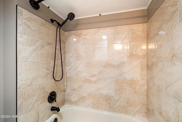 bathroom with tiled shower / bath combo