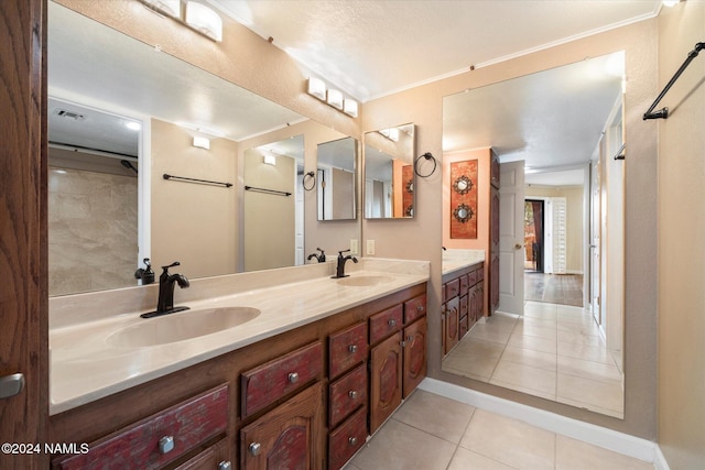 bathroom featuring vanity, ornamental molding, and tile patterned flooring