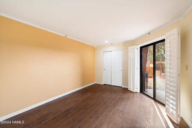 spare room with hardwood / wood-style floors and ornamental molding