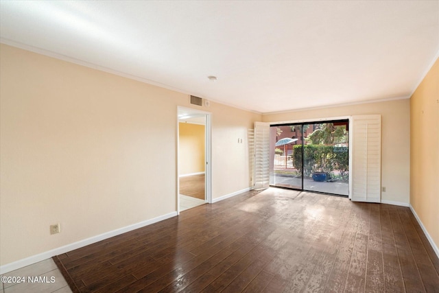 unfurnished room with hardwood / wood-style flooring and ornamental molding