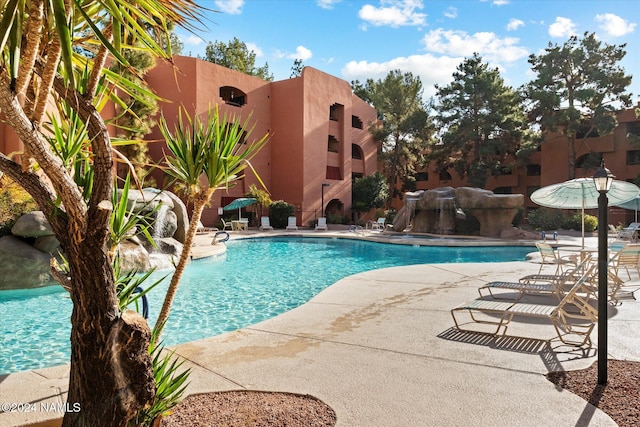 view of swimming pool featuring a patio