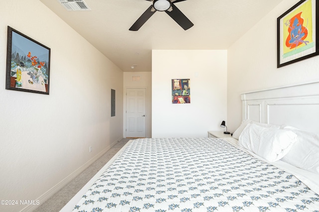 carpeted bedroom featuring electric panel and ceiling fan