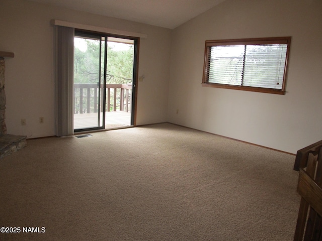 2422 N Whispering Pines Way, Flagstaff, AZ 86004 - unfurnished room featuring plenty of natural light, carpet floors, and lofted ceiling