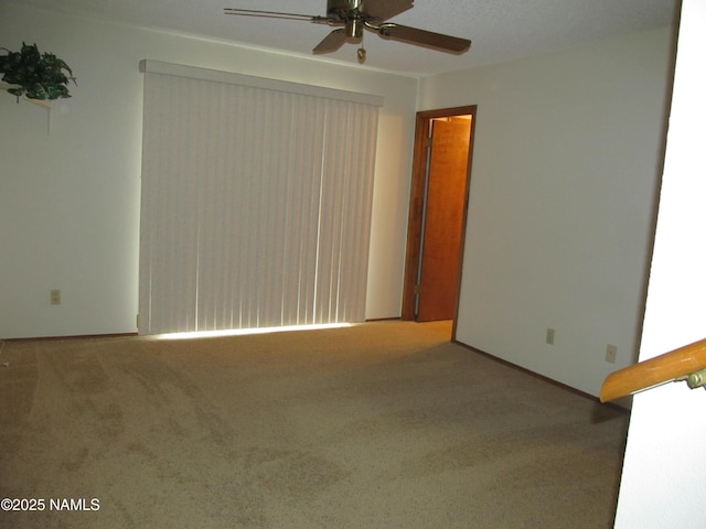 2422 N Whispering Pines Way, Flagstaff, AZ 86004 - spare room with ceiling fan and carpet floors