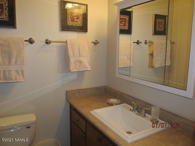 2422 N Whispering Pines Way, Flagstaff, AZ 86004 - bathroom with vanity and toilet