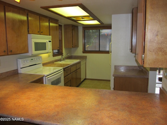2422 N Whispering Pines Way, Flagstaff, AZ 86004 - kitchen featuring white appliances, a sink, brown cabinets, light tile patterned floors, and tasteful backsplash