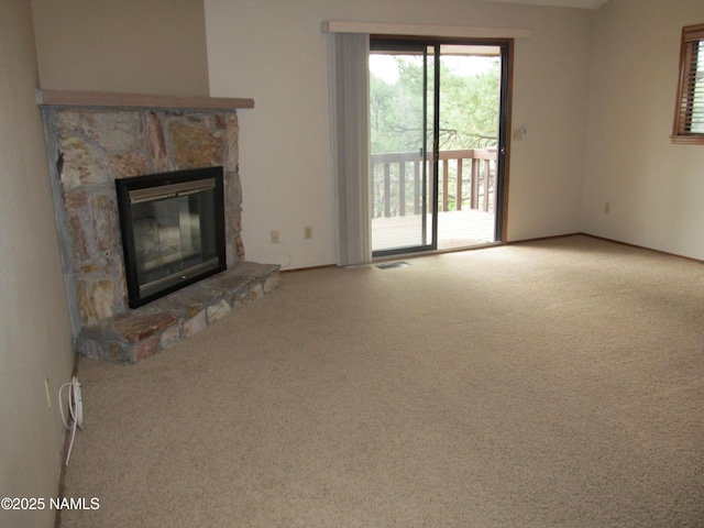 2422 N Whispering Pines Way, Flagstaff, AZ 86004 - unfurnished living room with a fireplace and carpet floors