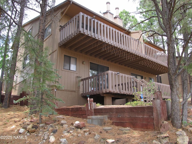 2422 N Whispering Pines Way, Flagstaff, AZ 86004 - back of property featuring a balcony and a chimney