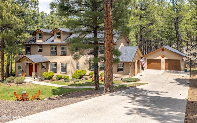 view of front of house featuring an outbuilding and a garage