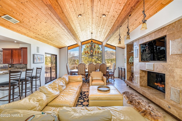 living room featuring light tile patterned flooring, a high end fireplace, lofted ceiling with beams, and wooden ceiling