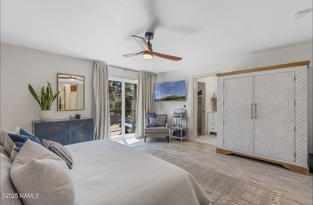 bedroom with access to exterior, wood finished floors, and ceiling fan