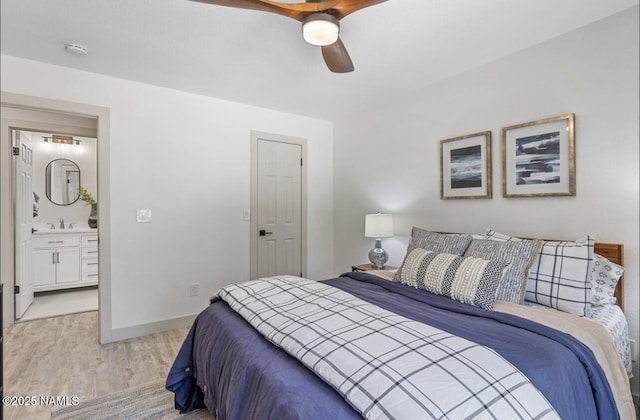 bedroom with light wood-type flooring, a ceiling fan, a sink, connected bathroom, and baseboards