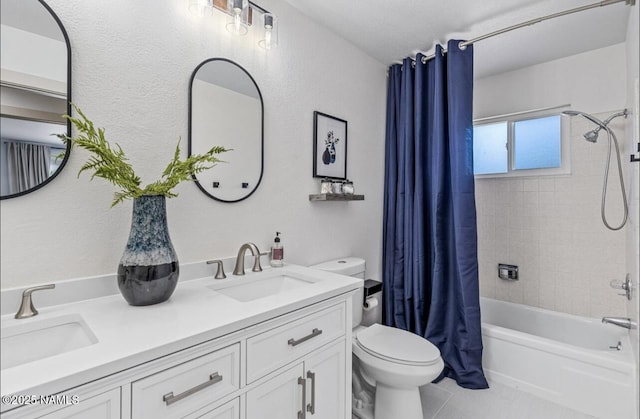 bathroom with a sink, shower / bath combo with shower curtain, toilet, and tile patterned flooring