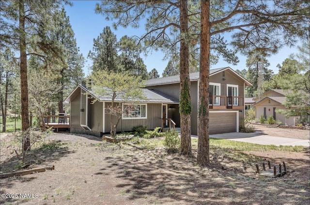 split level home with an attached garage and driveway