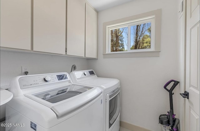 laundry room with cabinet space and independent washer and dryer