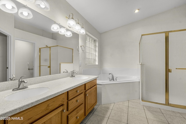 bathroom featuring tile patterned floors, vaulted ceiling, a shower stall, and a sink