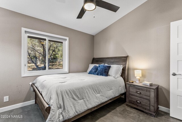 bedroom featuring ceiling fan and vaulted ceiling