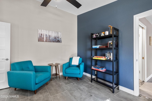 living area featuring ceiling fan