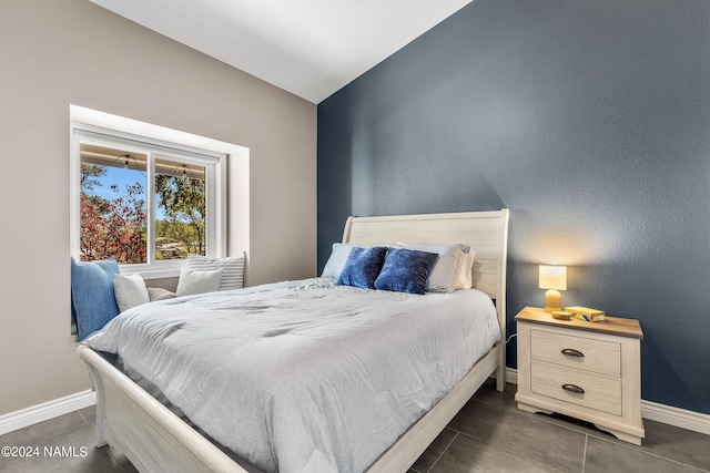 bedroom with lofted ceiling