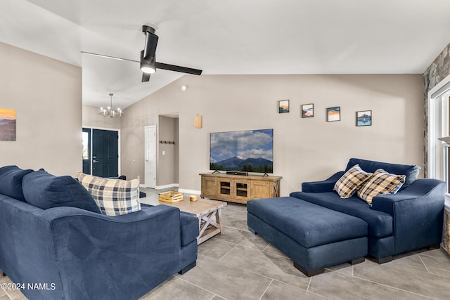 living room with a chandelier and vaulted ceiling