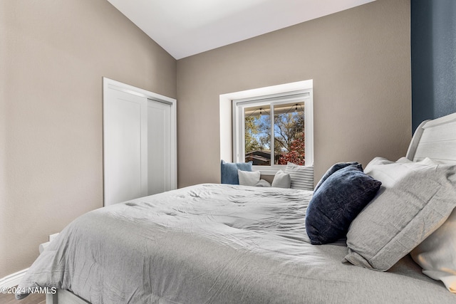 bedroom with vaulted ceiling