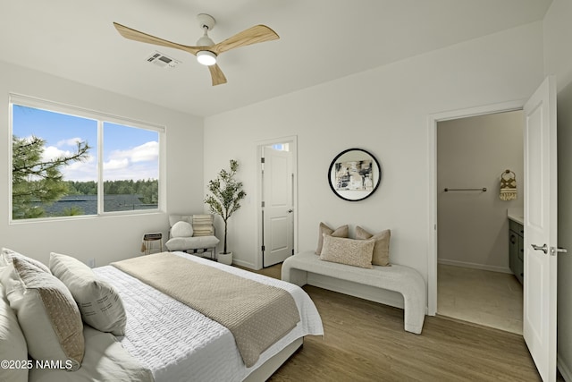 bedroom with ceiling fan and hardwood / wood-style floors