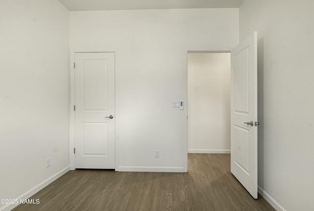 unfurnished bedroom with hardwood / wood-style flooring