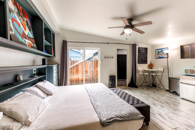 bedroom featuring lofted ceiling, a ceiling fan, wood finished floors, and access to exterior