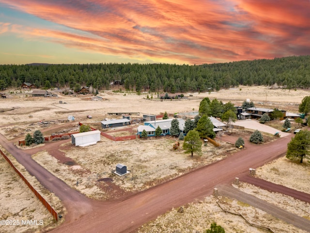 bird's eye view featuring a view of trees