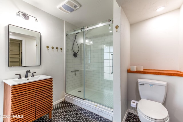 bathroom featuring a shower stall, toilet, baseboards, tile patterned flooring, and visible vents
