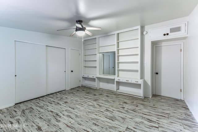 unfurnished bedroom with a ceiling fan and wood finished floors