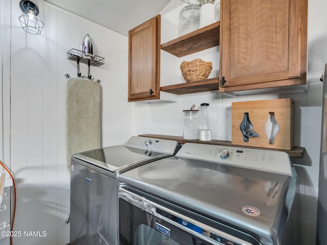 laundry room featuring washer and dryer and cabinet space