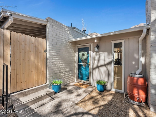 entrance to property with brick siding