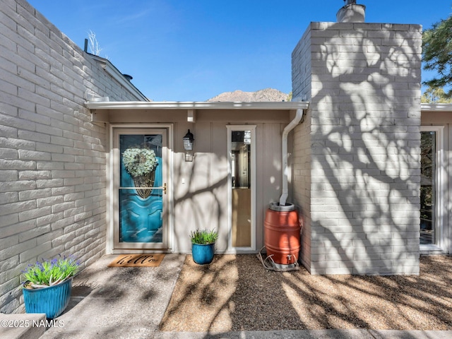 entrance to property with a chimney