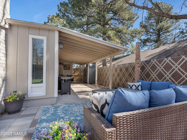 view of patio with fence and an outdoor living space