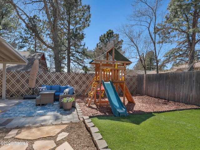 view of playground with a yard, a patio area, a fenced backyard, and an outdoor living space