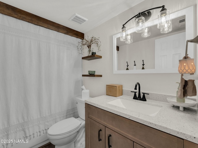 full bathroom with a shower with shower curtain, visible vents, vanity, and toilet