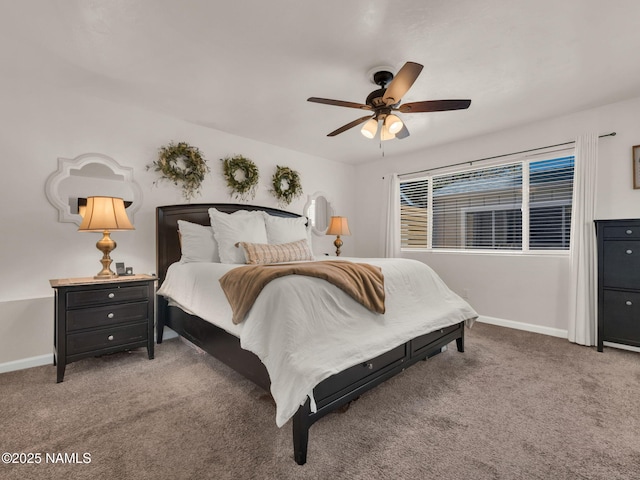 bedroom featuring ceiling fan, carpet, and baseboards